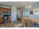 Charming kitchen featuring stainless steel appliances, tile flooring, and a cozy dining area at 11101 E Abilene Ave, Mesa, AZ 85208