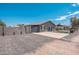 View of property with desert landscaping, block wall, and gate leading to the main house at 11450 E Elton Ave, Mesa, AZ 85208