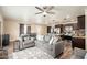 Relaxing living room with comfortable seating, neutral tones, and an open layout with the kitchen and dining room at 11450 E Elton Ave, Mesa, AZ 85208