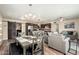 Open floor plan seamlessly integrates the kitchen, dining, and living area, creating a comfortable living space at 11450 E Elton Ave, Mesa, AZ 85208
