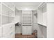 Organized walk-in closet with custom shelving, drawers, and ample hanging space at 129 E Los Andes Ln, Queen Creek, AZ 85140