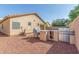 Well-equipped backyard with a built-in barbeque, seating, and easy-care landscaping at 12910 W Glenrosa Dr, Litchfield Park, AZ 85340