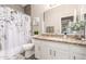 Full bathroom with decorative shower curtain and nice counter space at 12910 W Glenrosa Dr, Litchfield Park, AZ 85340