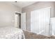 Bright bedroom with a double closet and beige carpet at 12910 W Glenrosa Dr, Litchfield Park, AZ 85340