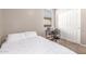 Neutral bedroom with white bedding, desk and double closet at 12910 W Glenrosa Dr, Litchfield Park, AZ 85340
