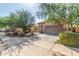 Attractive single-story home with a two-car garage and desert landscaping in a residential neighborhood at 12910 W Glenrosa Dr, Litchfield Park, AZ 85340