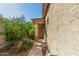 Inviting front porch with security door and lush landscaping at 12910 W Glenrosa Dr, Litchfield Park, AZ 85340