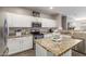Spacious kitchen with granite countertops, modern appliances, and abundant cabinet storage at 12910 W Glenrosa Dr, Litchfield Park, AZ 85340