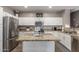 Beautiful kitchen featuring stainless steel appliances, granite countertops, and a functional center island at 12910 W Glenrosa Dr, Litchfield Park, AZ 85340