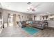 Open-concept living room with wood-look floors and patio access at 12910 W Glenrosa Dr, Litchfield Park, AZ 85340