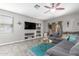 Comfortable living room area with built-in shelves and media center at 12910 W Glenrosa Dr, Litchfield Park, AZ 85340