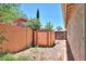 Fenced backyard with storage shed and views of neighboring houses at 1336 E Laurel Pl, Casa Grande, AZ 85122