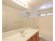 Well-lit bathroom featuring a single sink vanity with a large mirror and a shower-tub combo at 1336 E Laurel Pl, Casa Grande, AZ 85122