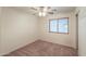 Comfortable bedroom with carpet, natural light from the window, and a ceiling fan for added comfort at 1336 E Laurel Pl, Casa Grande, AZ 85122