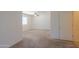 Neutral bedroom showcases carpet floors, a ceiling fan, and a crisp white door at 1336 E Laurel Pl, Casa Grande, AZ 85122