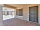 Welcoming covered front porch with brick flooring and a security door at 1336 E Laurel Pl, Casa Grande, AZ 85122