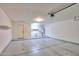 Clean garage with epoxy flooring, overhead lighting, and convenient shelving units at 1336 E Laurel Pl, Casa Grande, AZ 85122