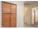 Hallway with a large wooden pantry and access to other rooms; ideal storage and organization at 1336 E Laurel Pl, Casa Grande, AZ 85122
