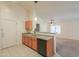 Open kitchen with wooden cabinets and a view into the living area, perfect for entertaining at 1336 E Laurel Pl, Casa Grande, AZ 85122