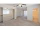 Spacious primary bedroom with a ceiling fan, ensuite bathroom, and mirrored closet doors at 1336 E Laurel Pl, Casa Grande, AZ 85122