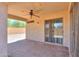 Covered patio with brick flooring, ceiling fan, and sliding glass doors leading indoors at 1336 E Laurel Pl, Casa Grande, AZ 85122