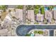 Drone's eye view displays a community with desert landscaping, pools, and neighborhood cul-de-sacs at 1409 E Goldenrod St, Phoenix, AZ 85048
