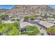 Stunning aerial view of home showcasing tile roof, desert landscaping, and mountain views at 1409 E Goldenrod St, Phoenix, AZ 85048