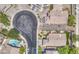Aerial view looking down on a quiet neighborhood with cul-de-sacs, yards, and desert landscaping at 1409 E Goldenrod St, Phoenix, AZ 85048