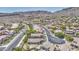 Stunning aerial view of a residential neighborhood nestled against the mountains, showcasing a well-planned community at 1409 E Goldenrod St, Phoenix, AZ 85048