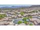 Expansive aerial view of a residential community, showcasing tile roofs and mountain views at 1409 E Goldenrod St, Phoenix, AZ 85048