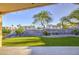 The backyard features a retaining wall and artificial grass at 1409 E Goldenrod St, Phoenix, AZ 85048