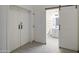 Bathroom with a barn door and white cabinets at 1409 E Goldenrod St, Phoenix, AZ 85048