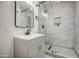 Bathroom featuring a glass shower with white marble-style shower walls at 1409 E Goldenrod St, Phoenix, AZ 85048