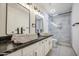 Modern bathroom featuring vessel sinks, black fixtures and glass enclosed shower at 1409 E Goldenrod St, Phoenix, AZ 85048