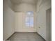 The bedroom has tile flooring, and a window with white shutters at 1409 E Goldenrod St, Phoenix, AZ 85048