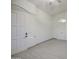 Bedroom featuring tile floors, vaulted ceiling, arched window and white doors at 1409 E Goldenrod St, Phoenix, AZ 85048