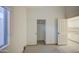 A small bedroom with tile floors, window, and sliding closet door at 1409 E Goldenrod St, Phoenix, AZ 85048