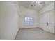 Bedroom featuring tile floors, vaulted ceiling, arched window and white doors at 1409 E Goldenrod St, Phoenix, AZ 85048