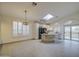 Spacious open-concept kitchen featuring a granite island and bright breakfast nook at 1409 E Goldenrod St, Phoenix, AZ 85048