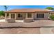 Backyard with patio and desert landscaping at 15011 W Verde Ln, Goodyear, AZ 85395