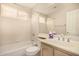 Bright bathroom with a shower-tub combo and large mirror at 15011 W Verde Ln, Goodyear, AZ 85395