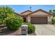 Charming single-story home with manicured landscaping and a two-car garage at 15011 W Verde Ln, Goodyear, AZ 85395