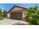 Well-maintained home with a two-car garage and desert landscaping at 15011 W Verde Ln, Goodyear, AZ 85395