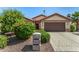 Charming single-story home with manicured landscaping and a two-car garage at 15011 W Verde Ln, Goodyear, AZ 85395