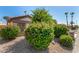 Landscaped front yard featuring colorful bushes and desert landscaping at 15011 W Verde Ln, Goodyear, AZ 85395