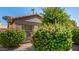 Landscaped front yard featuring colorful bushes and desert landscaping at 15011 W Verde Ln, Goodyear, AZ 85395