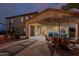 Spacious back patio with outdoor dining, lounge area, and seamless indoor-outdoor flow at 16178 W Granada Rd, Goodyear, AZ 85395