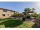 Expansive backyard with a pool, pergola, and lush landscaping, creating a serene and inviting outdoor space at 16178 W Granada Rd, Goodyear, AZ 85395