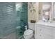 Bathroom with glass shower, commode, and white vanity sink at 16178 W Granada Rd, Goodyear, AZ 85395