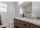 Modern bathroom with a double sink vanity, tiled shower, and contemporary fixtures offering style and functionality at 16178 W Granada Rd, Goodyear, AZ 85395